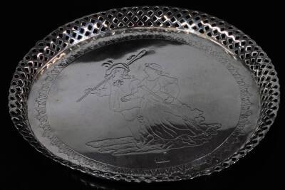 An early 19thC dish, with shallow lattice border, the inner chased with figures and titled Roada Llega, hallmarked, probably Portugal, white metal, 9cm Dia, 7oz.