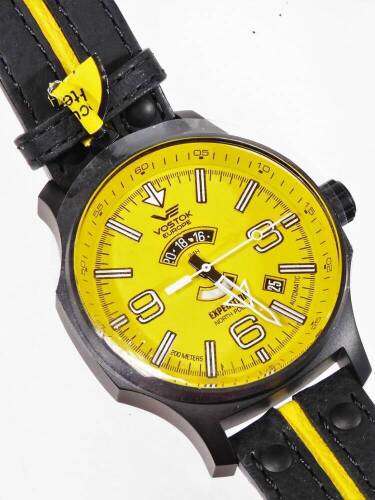 A gentleman's Vostok Europe Expedition North Pole wristwatch, with 4.5cm Dia. yellow back dial, with Arabic and baton numerals, with a yellow and black bracelet, as new. (in outer box with paperwork and packaging)