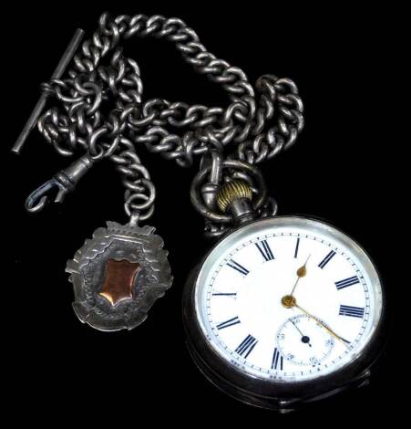 An open faced pocket watch, probably late 19thC, with 4cm Dia. Roman numeric dial and subsidiary Arabic second hand, partial engine turned cased marked O.935, 7cm H, attached to a silver graduated Albert watch chain with fob, 4½oz all in.