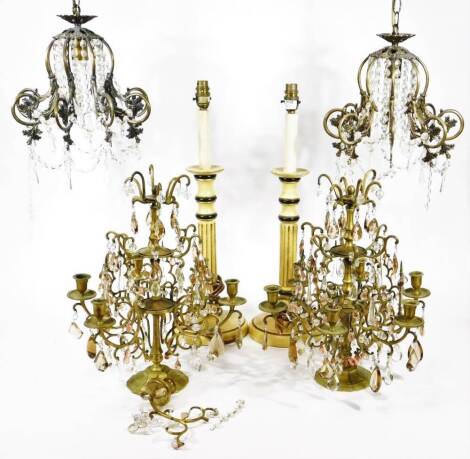 A pair of George IV style gilt and cut glass mounted multi-light candelabra, with shaped central sections, with graduated stems and urn dish holders, on shaped bases, with cut glass droppers, 40cm H, two late 20thC cut glass light shades and a pair of tur