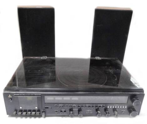 A Mitsubishi MC-7500 music centre, with front tuning knobs, turntable and two SS075 speakers, 48cm H. (3)