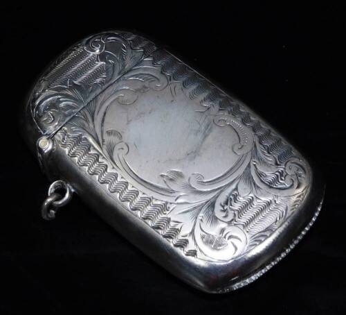 A Victorian silver vesta case, of oblong form, chased with scrolls and a geometric pattern, with match strike base and ring side, Birmingham 1896, 6cm H.