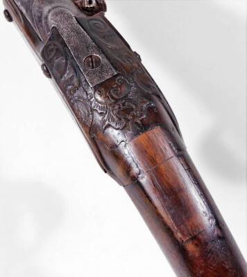 An early 19thC flintlock pistol, with long barrel, silvered mount and shaped handle, with ram rod, unmarked, 51cm L. (AF) - 5