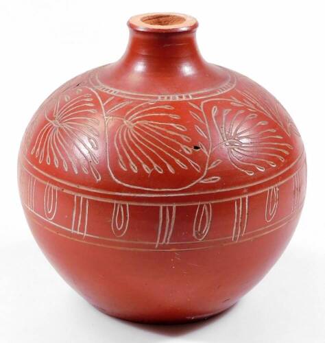 A red stoneware vase, of globular form, decorated with a relief fern and geometric pattern, 22cm H.