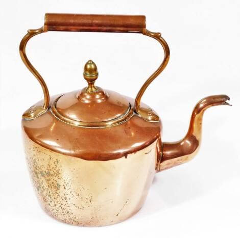 An early 20thC copper kettle, with fixed cylindrical handle, compressed domed lid with acorn finial and shaped spout, 28cm H.