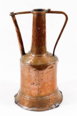 A late 19thC Middle Eastern copper vessel, with cylindrical stem flanked by shaped handles, on a bell shaped body with stapled metal base, 40cm H.
