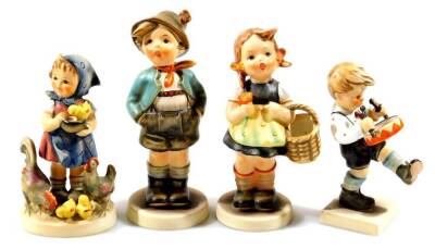 Various Goebel Hummel figures, boy singing, 16cm H, drummer boy, etc. printed marks beneath. (4)