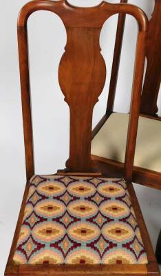 A set of four early 20thC walnut Queen Anne style dining chairs, each with carved hour back splats, drop in seats, on turned cabriole legs terminating in pad feet, 110cm H. (4, AF) - 2