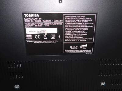 A Toshiba Regza 32 inch colour television, in black trim with remote control and wire. - 2