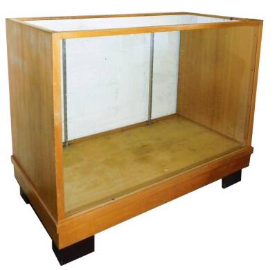 A 20thC oak draper's shop cabinet, of rectangular form, with shelf to the interior, on block feet, 93cm H, 121cm W, 59cm D.