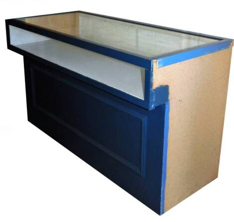 A jewellery shop cabinet, of rectangular form, with two piece glass top, on a block panel base, painted blue, 82cm H, 135cm W, 63cm D.