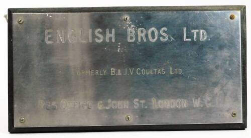 An English Bros Ltd London wall plaque, marked B & J Coultas, 6 St John Street, signed, in metal on a wooden ground, 42cm W.