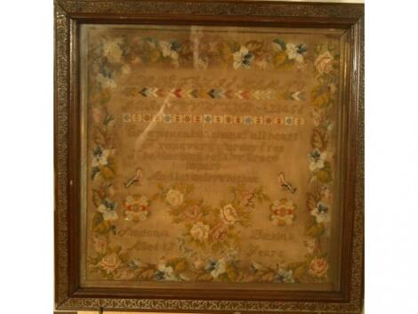 A 19thC sampler, by Antonia Dickins, aged 12 years, worked in coloured