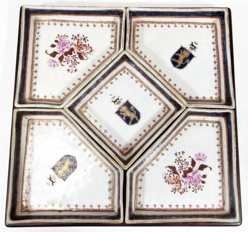 A Chinese export porcelain sweet meat dish serving set, with square central dish surrounded by four other shaped examples, with gilt highlights, two set with horse surmounted lion shields, the other two with a bouquet of flowers, predominately in pink and