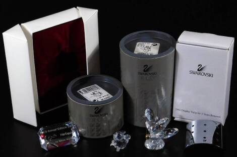 A boxed Swarovski crystal butterfly, 5cm H, field mouse, harlequin crystal figure and a display tulip. (4)