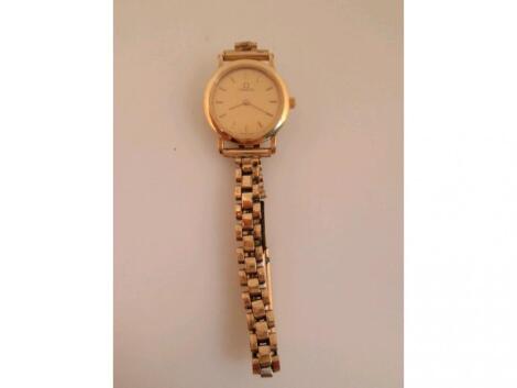 A ladies gold plated Omega de Ville quartz wristwatch on unassociated bracelet