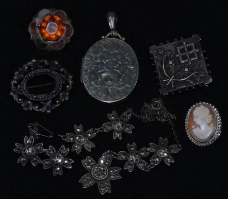 Various silver and silver plated jewellery, comprising a Victorian oval locket with floral engraved design, a silver cameo pendant brooch, an agate set brooch (AF), marcasite necklace and brooch (AF), and two further brooches.