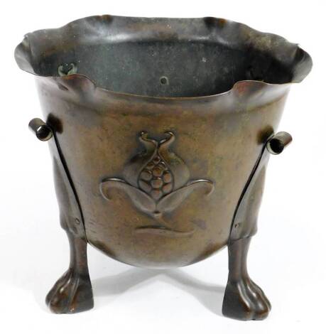 A 19thC Art Nouveau metal jardiniere, with ribbon shaped bowl, raised with lotus flowers, on triple hairy paw feet, registered number beneath, 29cm H.