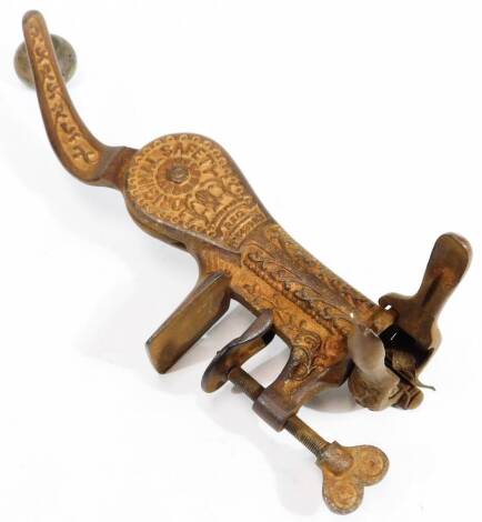 An early 20thC original safety cast iron pub mounted bottle opener corkscrew, with articulated handle, turned knop, florally shaped body and screw end, with shaped bottle opener feature, stamped and marked with registered number, 32cm H.