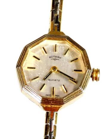A Rotary ladies wristwatch, on gold plated strap in stainless steel casing, with octagonal dial, boxed.