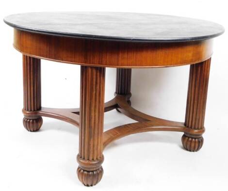 An Anglo Indian padouk centre or dining table, of circular form, with painted top on heavy turned legs terminating in ball feet, joined by an inverted stretcher, 80cm H, 130cm Dia.