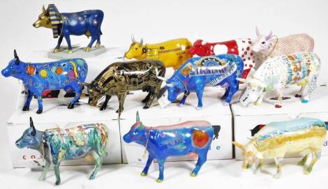 Eleven various Cow Parade Westland gift ware figure groups, to include one in blue decorated with stars and balloons, 12cm H, etc. (11)