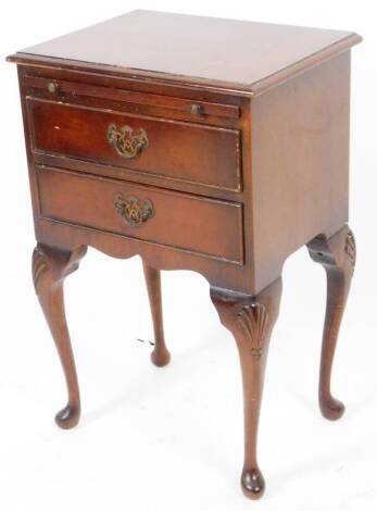 A mahogany side cabinet, of rectangular form, with slide above two cockbeaded drawers, with plate back handles, on cabriole shell capped pad feet, 67cm H, 44cm W, 32cm D.