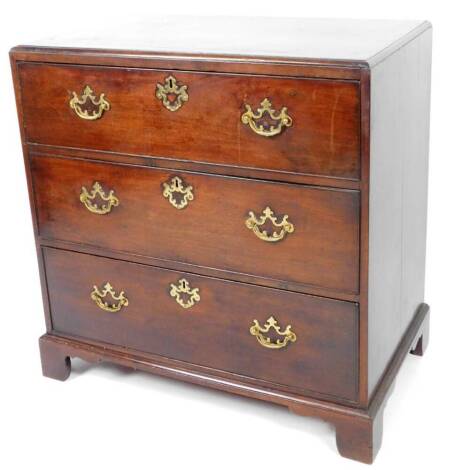 An early 19thC mahogany chest, of three long cockbeaded drawers, on bracket feet, the top with a wide crossbanding, 86cm H, 83cm W, 50cm D.