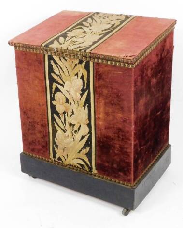 A partially embroidered box, with striped floral decoration on a red ground, on block base with castors, 73cm H, 58cm W, 43cm D.