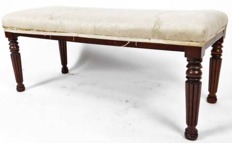 A 19thC mahogany window seat, with overstuffed seat, on reeded legs, in the manner of Gillows, but unmarked, 40cm H, 100cm W, 44cm D.