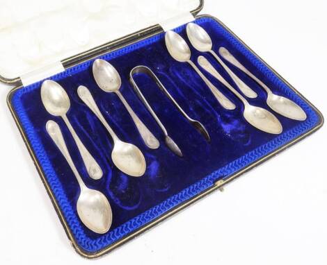 A cased set of George V silver teaspoons, monogrammed with a W, 13cm W, with sugar bows, in fitted case. Sheffield 1914. (a quantity cased AF)