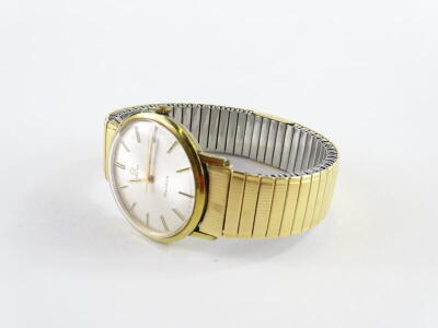 An Omega Geneve gentleman's wristwatch, with circular silvered dial, in gold coloured casing with a stainless steel back, on expanding stainless steel and gold plated watch strap, numbered 558, dial 3cm W. - 2