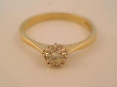 A diamond solitaire ring