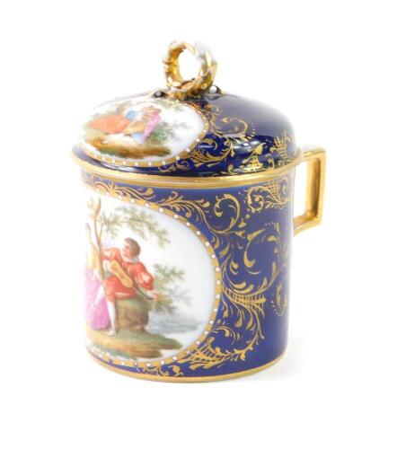 A Berlin 19thC porcelain chocolate pot and cover, reserve decorated with courting figures after Watteau, against a cobalt blue ground, gilt heightened, 10.5cm H.