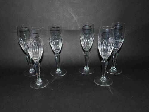 A set of six Dartington cut glass champagne flutes, with semi fluted and leaf engraved bowls, raised on hexagonal baluster stems, etched mark, 21cm H.
