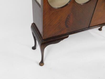 An Edwardian mahogany display cabinet, the shaped pediment over two glazed panelled doors, opening to reveal two later glass shelves, raised on cabriole legs, 197cm H, 120cm W, 33cm D. - 3