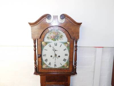 A George III oak longcase clock, the break arch enamel dial painted with floral spandrels, circular dial bearing Roman numerals, subsidiary seconds dial and date aperture, two train eight day movement with bell strike, the break arch hood with turned colu - 2