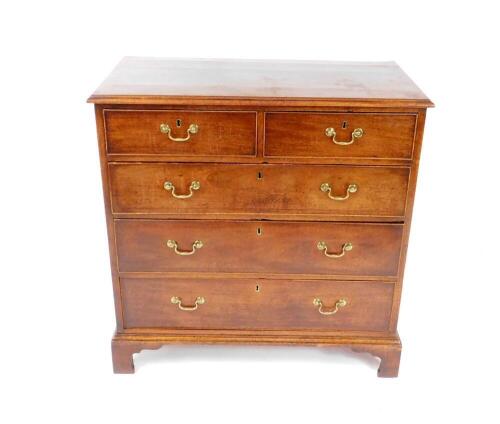 A George III mahogany chest of drawers, with two short over three long graduated drawers, raised on bracket feet, 96cm H, 95cm W, 49.5cm D.