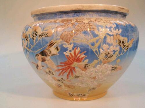 A late 19thC Japanese satsuma jardiniere decorated with birds and flora