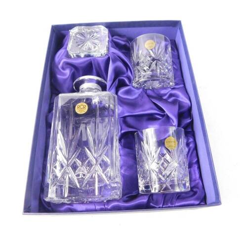 A Royal Crystal Rock cut glass decanter set, comprising square cut whiskey decanter and stopper and a pair of whiskey tumblers, boxed.