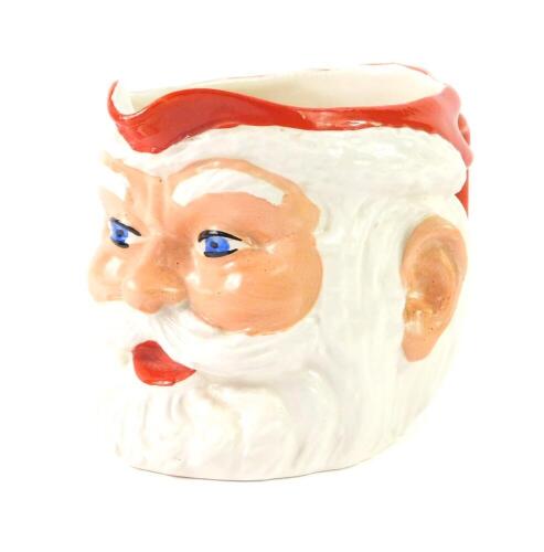 A 1950's pottery character jug modelled as Father Christmas, for Birds Custard, printed and painted marks, 10.5cm H.