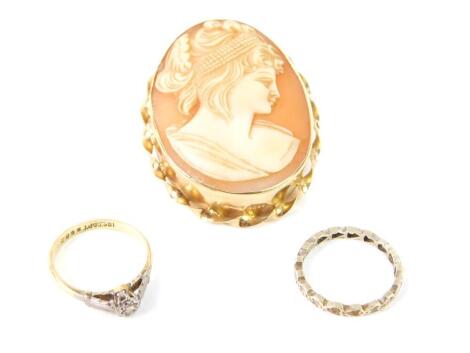 A 9ct gold and shell cameo brooch, bust portrait of a lady, 9.3g, an 18ct gold platinum and diamond set solitaire ring, size L, 2.2g, and a 9ct white gold full eternity ring, size L, 1.3g. (3)