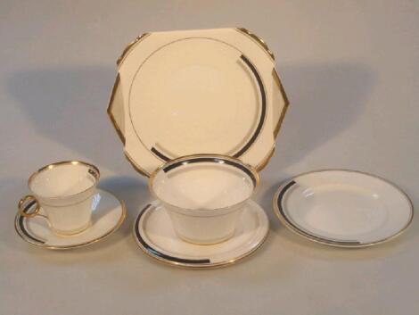 A Shelley part tea service of art deco design decorated with partially