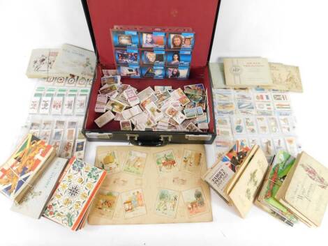 Will's Ogden's John Player and other cigarette cards, including Ogden's Yachts and Motorboats, Fire Fighting Appliances, Leaders Of Men, and Lucky Charms, sets and part sets, in books and loose, together with further trade cards. (qty)