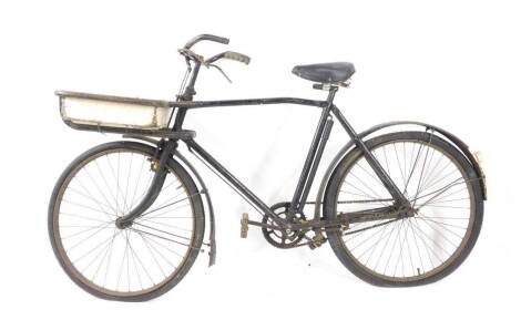 An Hercules Cycle & Motor Company bicycle, painted black, with front mounted wooden basket, registration number 724221.