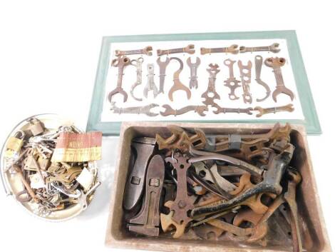 Motorcycle and automobile spanners, for BSA, Regent, Austin, framed, together with hand tools.