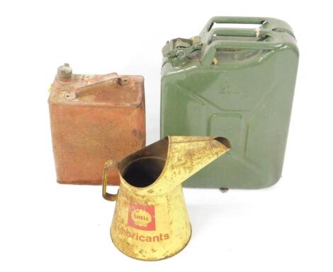 A Shell Lubricants can, a petrol can and a jerry can. (3)