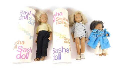 Two Sasha dolls, with blonde hair, and clothes, boxed, together with a Sasha baby doll, clothed. (3)