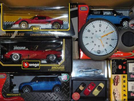 Burago Vanguards Chad Valley and other die cast vehicles, including Mini Coopers, a Burago Jaguar E Cabriolet 1961, scale 1:18, and a Mini wall clock. (qty)