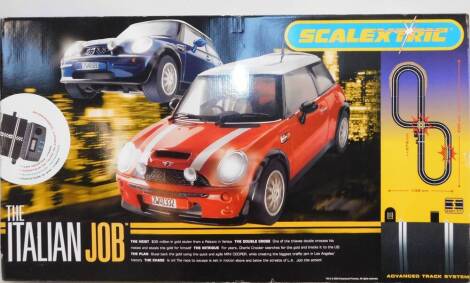 A Scalextric The Italian Job Sports Set, with two Mini Coopers and advanced track sytem, boxed.